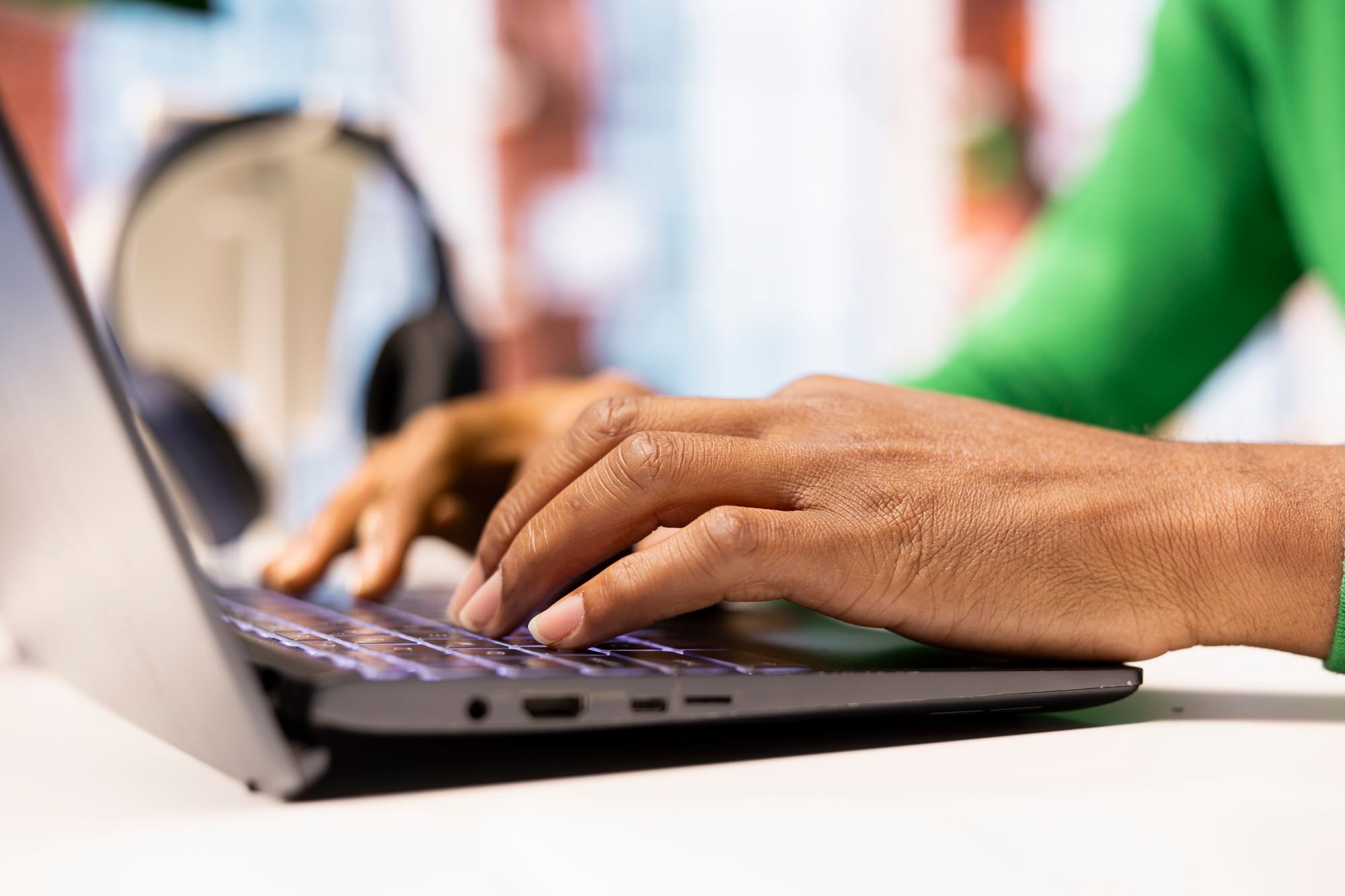 Person Using Laptop To Compose Social Media Posts