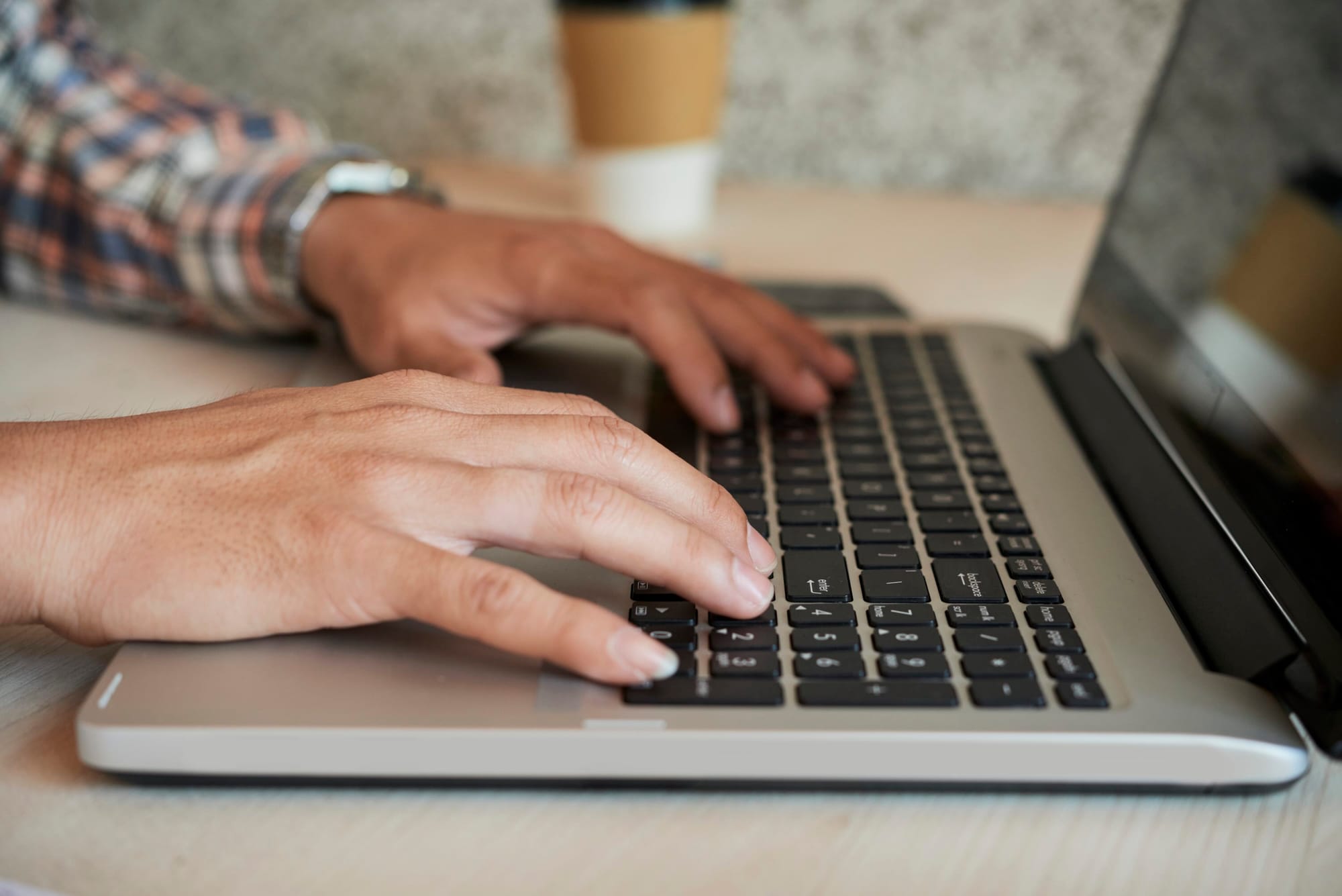 Hands Of Man Working On Laptop